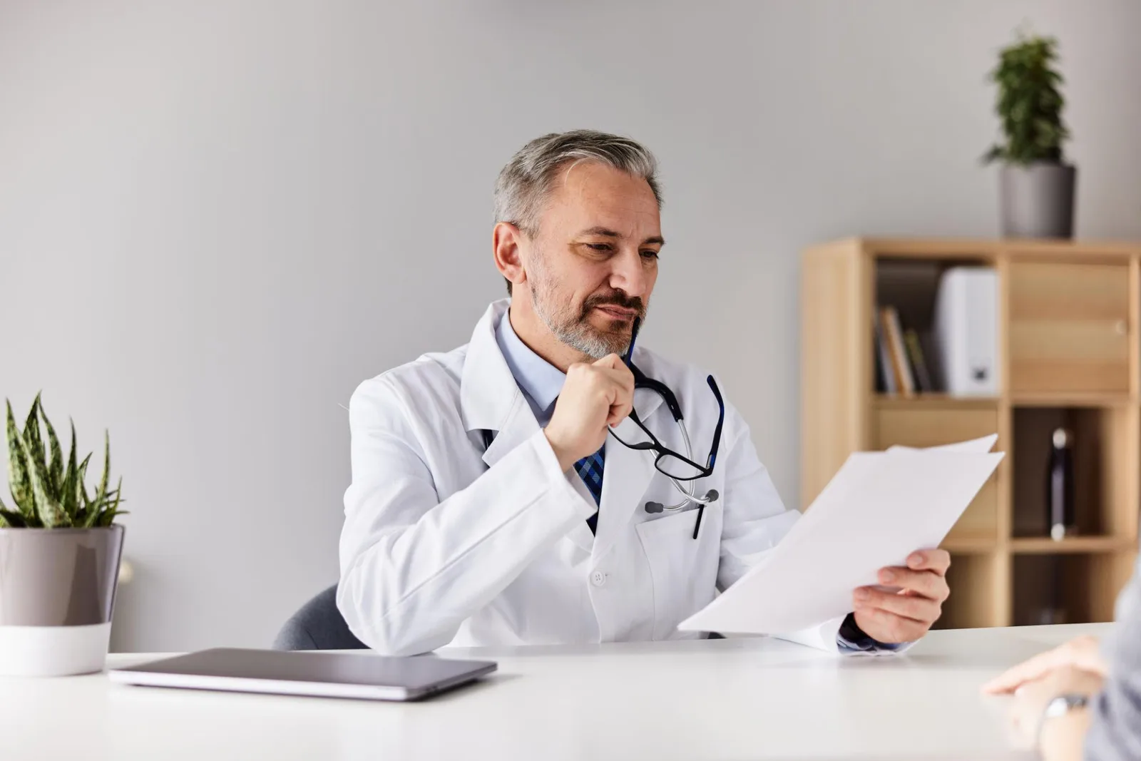 Healthcare professional reviewing patient information